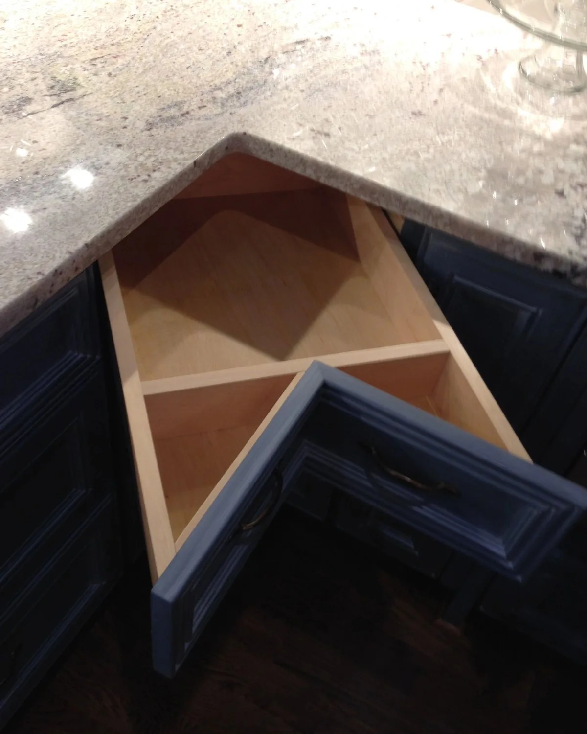A corner drawer built to follow the angle of the counter